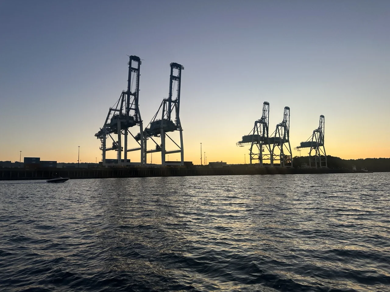 Container cranes along the Northwest waterfront at sunset